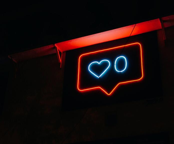 Social media likes icon in neon lights